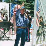 pastor mitchell preaching at a 4th july outreach